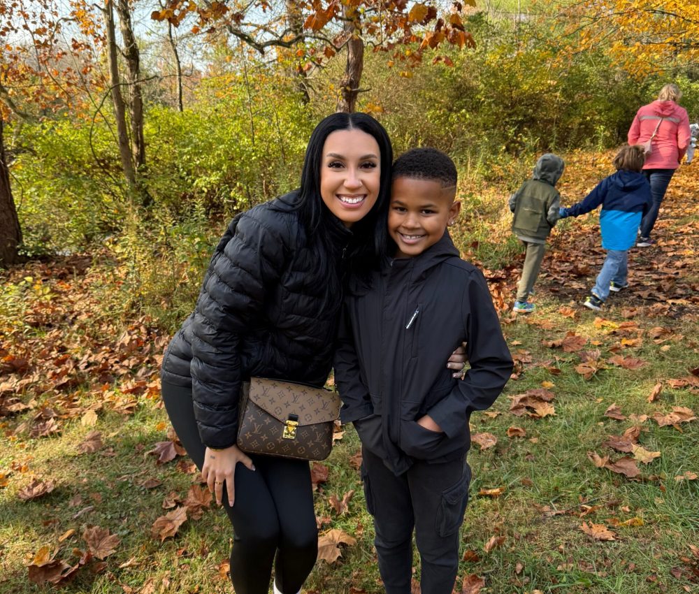 Mother and son surrounded by fall foliage