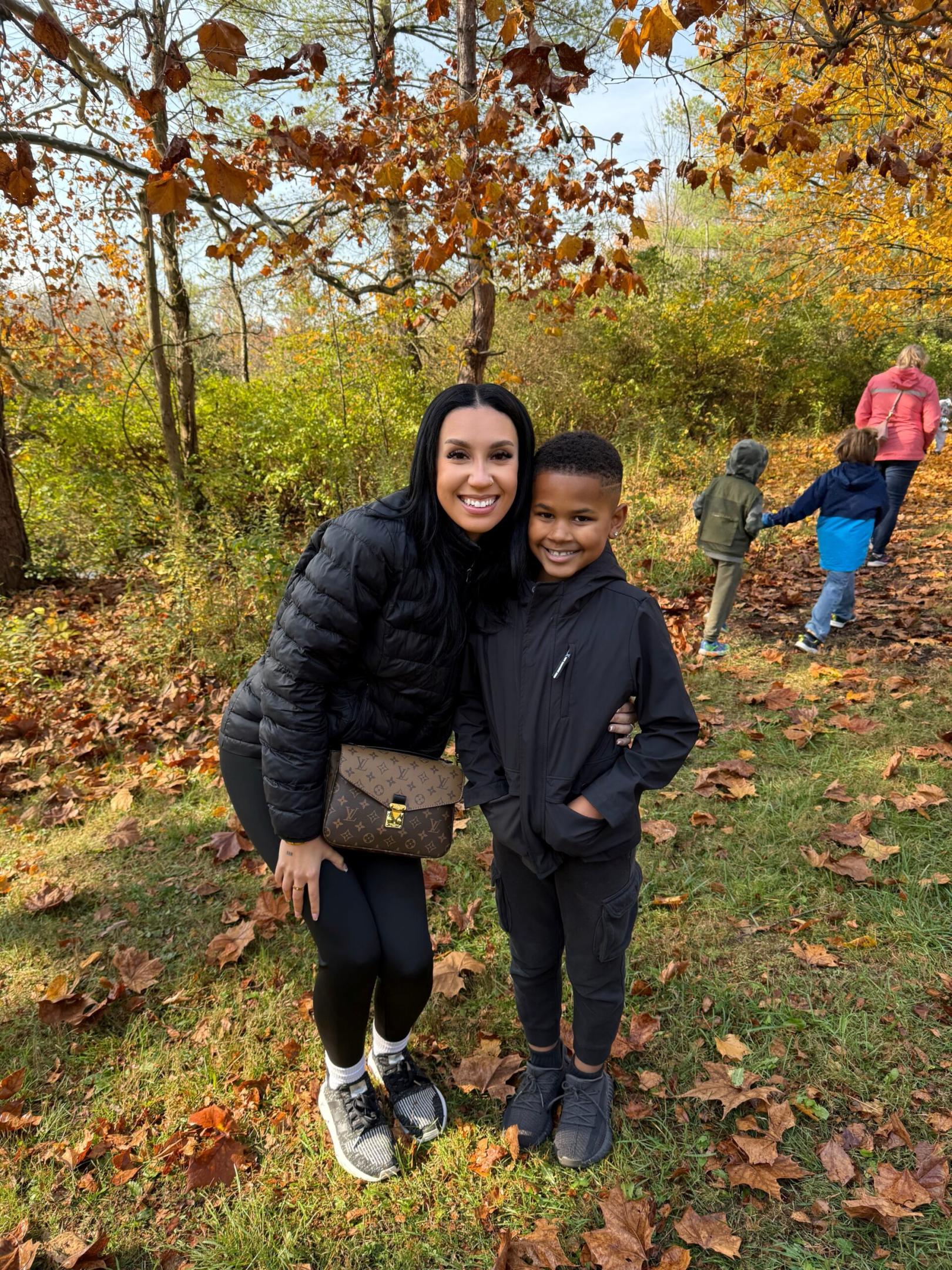 Mother and son surrounded by fall foliage
